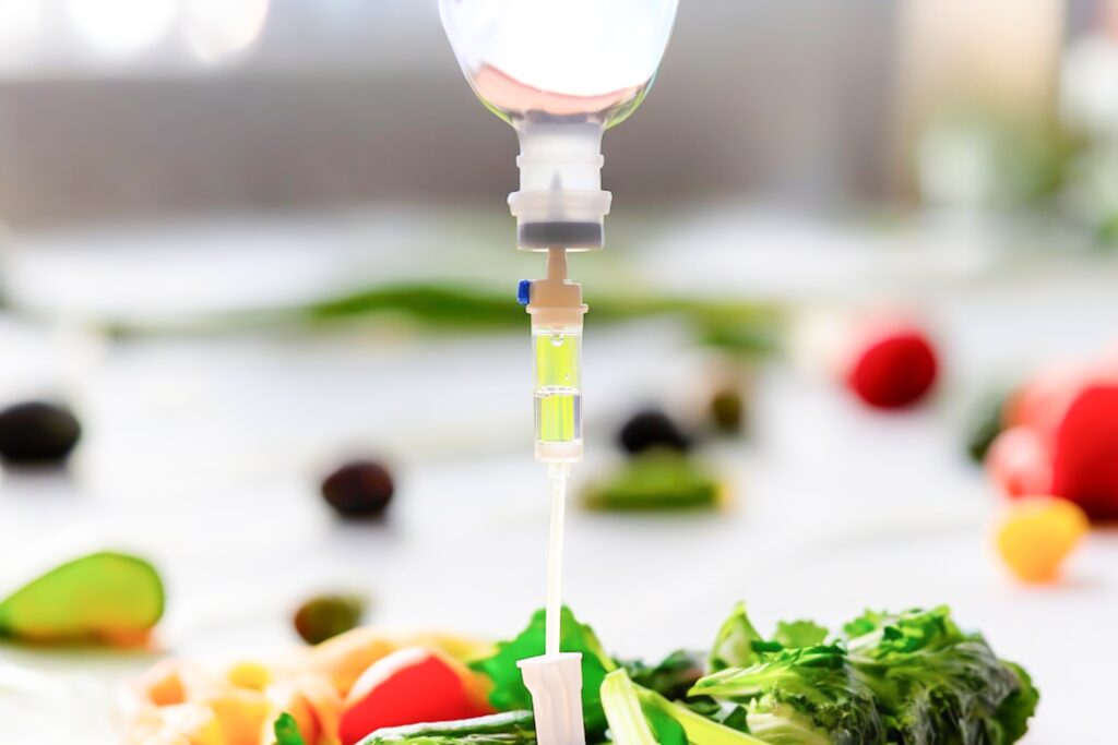 Vitamin iv drip fruits natural therapy medical use iv vitamins intravenous fluid care patients loss nutrition and loss minerals weight and medical technology concept.